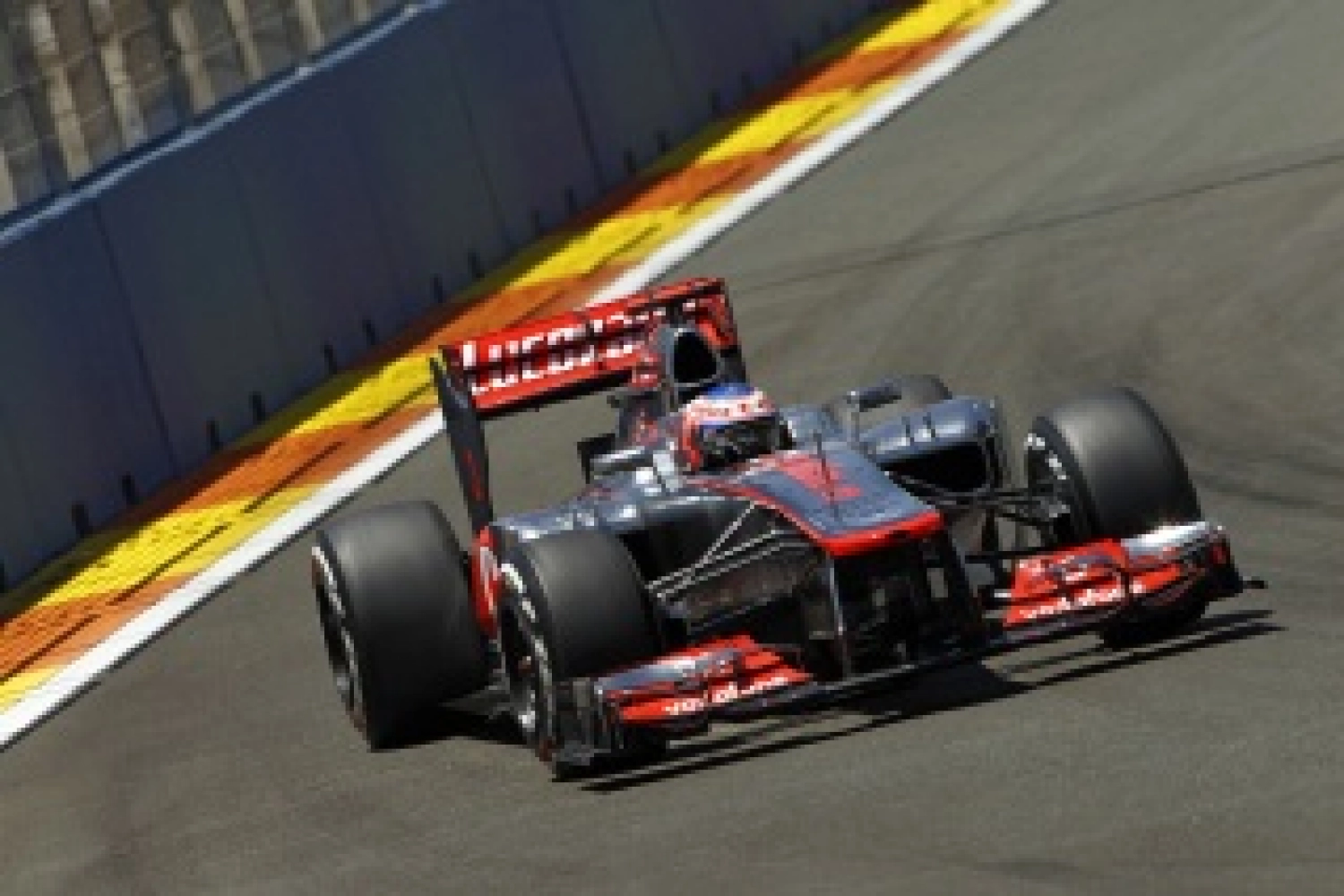 Saturday: Button secures his first pole position for McLaren