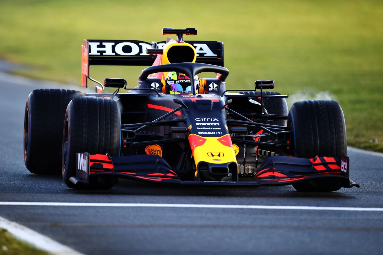 Sergio Perez takes control of his Red Bull at Silvertsone