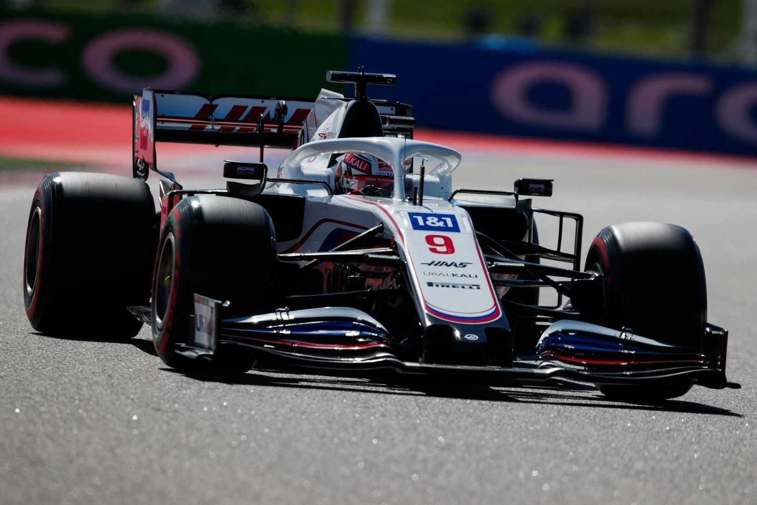 Kimi Räikkönen and Nikita Mazepin speeding in the pits