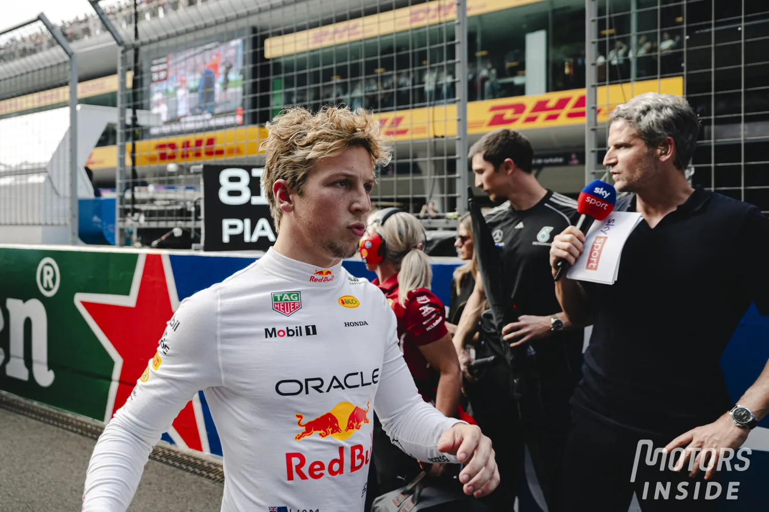 Liam Lawson and Yuki Tsunoda reverse their bays at the Japanese Grand Prix